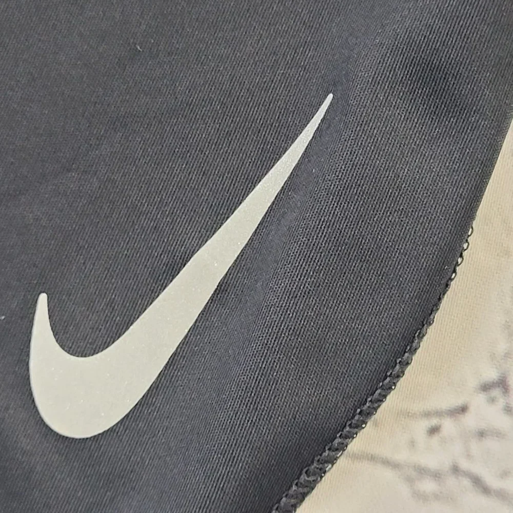 Nike Dri fit woman’s black lightweight active y-shirt size S